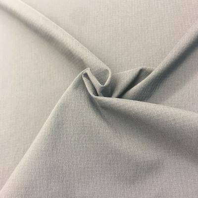 China Hot Selling Stretch Polyester 75d 4 Way Stretch Dobby Weave Double Rip-Stop Yarn Elastic Fabric For Pant Jogging Apparels for sale