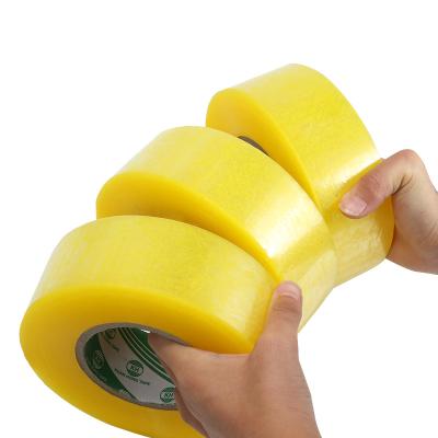 China Waterproof Custom Logo Clear Carton Sealing Packing Tape Yellow Jumbo Roll No Noise BOPP Packing Tape for sale