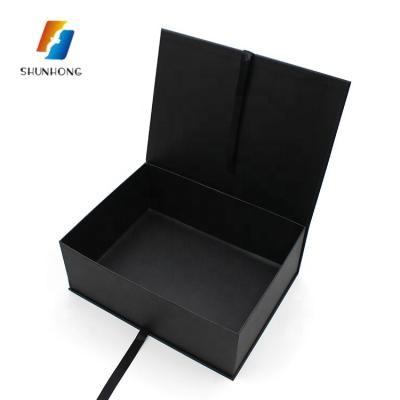 China Book Shaped Paper Cardboard Ribbon Closing Folding Black Gift Boxes Recyclable With Hot Stamping for sale