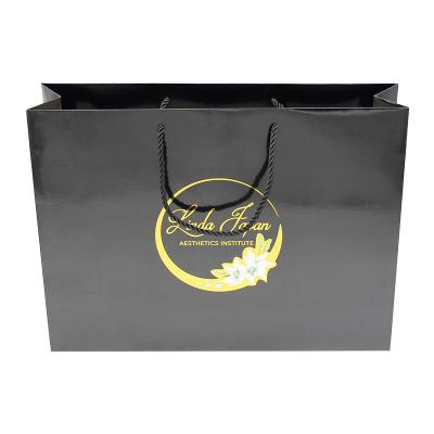 China Recyclable Custom Luxury Black Packaging Gift Bag Shopping Bags With Logos For Clothes for sale