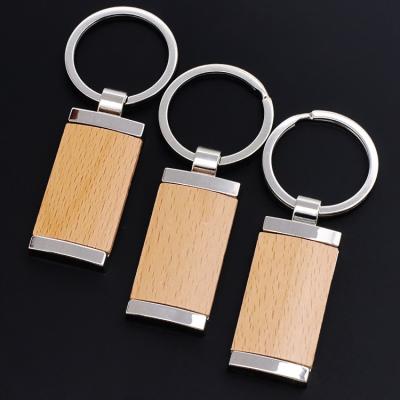 China Eco-friendly Laser Cutting Machine Phone Holder Name Elastic Key Ring Beads Bracelet Blank Wooden Key Chain With Tassels for sale