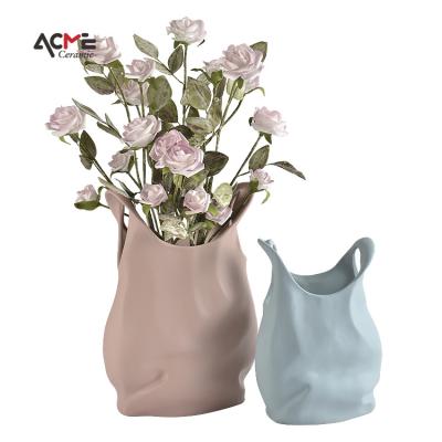 China Nordic Creative Ceramic Art Handbag Flower Bag Fashion Vases Items Ceramic Vase Red Blue Flower Vase For Home Decor for sale