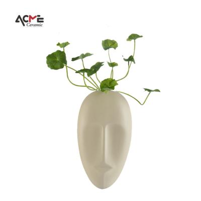 China Modern Western Interior Stylish Popular Home Decoration Ornament Farmhouse Ceramic Wall Hung Vase With Human Face for sale