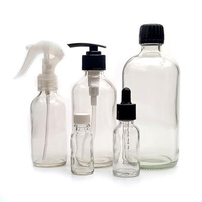 China 2021 Personal Hot Sale Low Price 2oz Boston Personal Packaging Skin Care Round Glass Durable Clear Bottle For Shampoo for sale