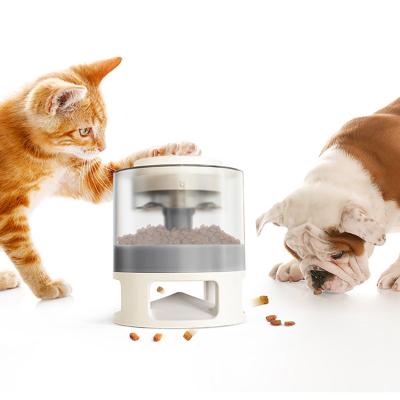 China Automatic Smart Push Eat Bowl Slow Dog Pet Interaction Feeder Dry Cat Food Dispenser Container Cat Cereal Dispenser With Button for sale