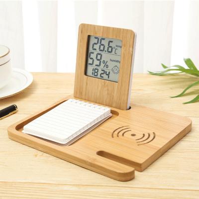 China Calendars Bamboo Digital LCD Desktop Alarm Clock Wireless Charger Wooden Electronic Table Clock with Temperature Humidity for sale