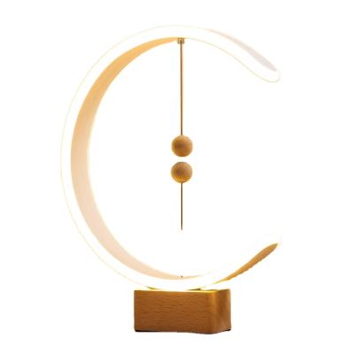 China Modern Smart Magnetic Balance LED Pendant Lamp Table Night Light Creative Table Lamp for sale