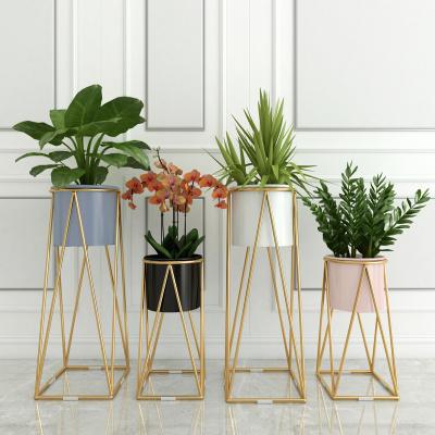 China Simple Modern Beauty Modern Design White Metal Planter Gold Black Flower Pots And Planters for sale