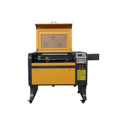 China Laser CUT 4060 CO2 Laser Machinery Laser Cutting Machine CNC Laser Cutter with 50w 60w factory in Liaocheng for sale