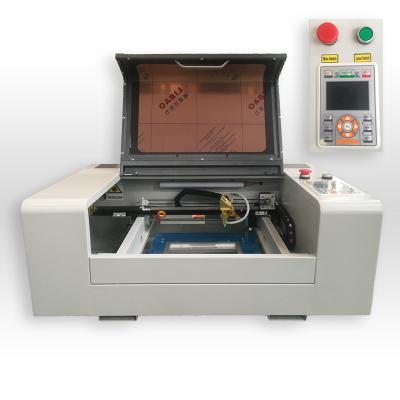 China Small Marking 40W 50W WER3020 Deep CO2 Laser Engraving Machine For Nonmetallic And Handwork for sale