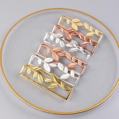 China Sustainable Stylish Colorful Hollow Square Shape Leaf Napkin Ring for sale