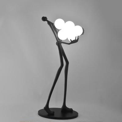 China Abstract Nordic Polyresin Lamp Cute And Lovely Human With Ball LED Floor Stand Lamp Light for sale