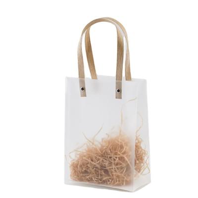 China Simple and Beautiful Top Selling Snap Button PP Plastic Bag Paper Flat Rope Cosmetic Clear Plastic Tote Bag Handbag for sale