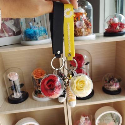 China Popular Cute Preserved Flower Gifts Preserved Rose Creative Crystal Rubber Shoe Key Dog Key Chains Pendant For Gifts Or Decoration for sale