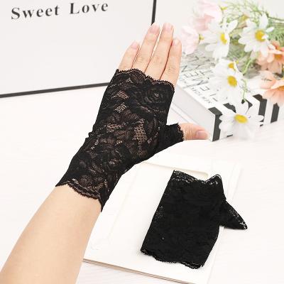 China Comfortable Women Short Sexy Fingerless Lace Gloves Driving Summer UV Thin Wedding Party Gloves Sunscreen Decorative Half Finger for sale