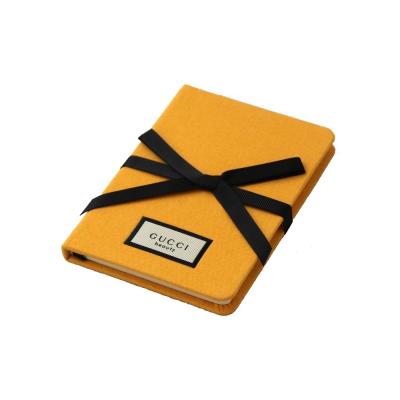 China 144 Line Ruled Pages Hardcover Notebook Yellow With Ribbon Bow Closure for sale