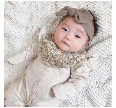 China Soft Cotton Girl's Disposable Warm Waterproof Baby Bibs Baby Feeding Driver Bibs Angel Wing Polka Dot Ruffle Baby Bibs Pu Feeding Bibs for sale