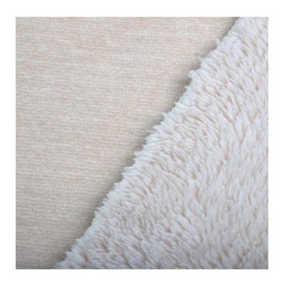 China 520gsm Comfortable Anti-Static Knitted Integrated Jacquard Coral Fleece Fabric No Bonding For Garment for sale