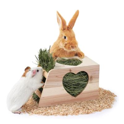 China Creative Pure Natural Cute Rabbit Hay Shape Oak Design Liveable Animal Feeders for sale