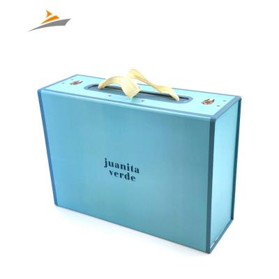 China Manufacturer Supply Custom Printing Recyclable Rigid Cardboard Paper Magnetic Folding Packaging Box With Ribbon Handle for sale