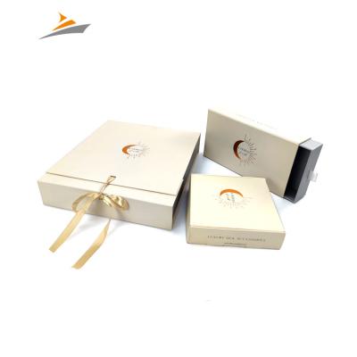 China Recyclable Wholesale High End Custom Size Design Apparel Or Cosmetics Matt Gold Flip Paper Gift Box With Ribbon for sale