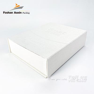 China Customized Design Recyclable Printing White Cardboard Magnetic Flip Box Embossed Cosmetic Paper Packaging for sale