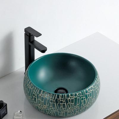 China Matt Hand-carved Artistic European Design Porcelain Bathroom Sink Matte Green Glazed Ceramic Bowls Ceramic Sanitary Ware for sale