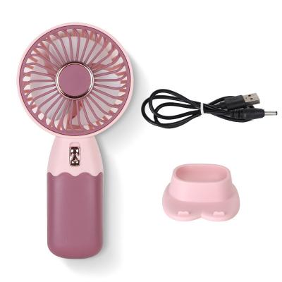 Cina Creative Cartoon Mini Handheld Cooling Piccolo Ventilatore Portatile USB di ricarica del telefono Stand Piccolo Ventilatore 2024 RAMADAN Prodotto in vendita