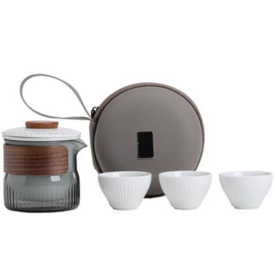 Chine Ensemble cadeau de présentation Dongli Voyage Express Ensemble de tasse Portable Sac rond Un pot Trois tasses Ensemble de thé d'affaires cadeau à vendre