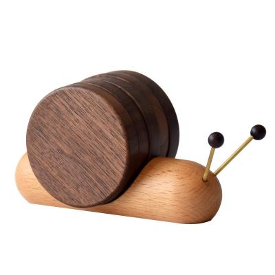 China Cartoon Black Walnut Snail Cup Cushion Wood Tea Cushion for Insulation and Decoration for sale