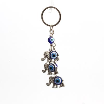 China Devil's Eye Lucky Elephant Pendant Keychain Fashionable Blue Eye Turkish Handbag Fashion Keychains Pendant for sale