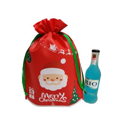 China PUNCH Santa Claus Christmas Candy Gift Bags Wholesale Red Nonwoven Drawstring Bags for sale