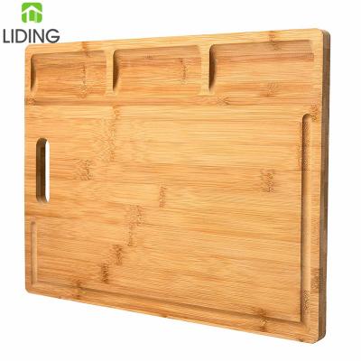 China Large Viable Bamboo Cutting Board with 3 Dividers and Built-in Juice Grooves for sale