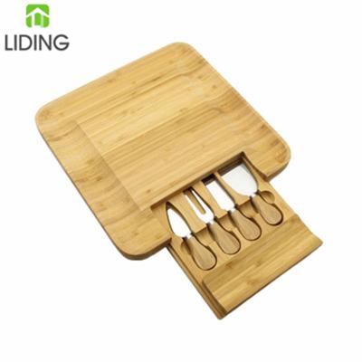 China Sustainable Bamboo Cheese Board Set Charcuterie Board With Knives And Cheese Serving Tray for sale