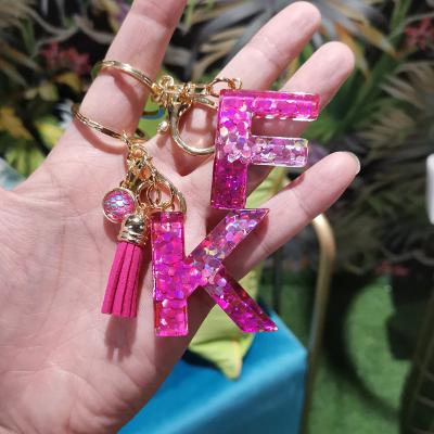 China Trendy Pendant Acrylic Jewelry Hot Pink Sequin Letters Round Fish Scale Keychains With Leather Tassel for sale