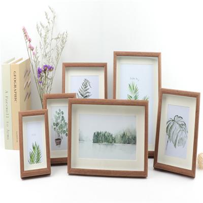 China Wooden Picture Frame Made Of Solid Wood Wall Mount Photo Frame Carbonized for sale