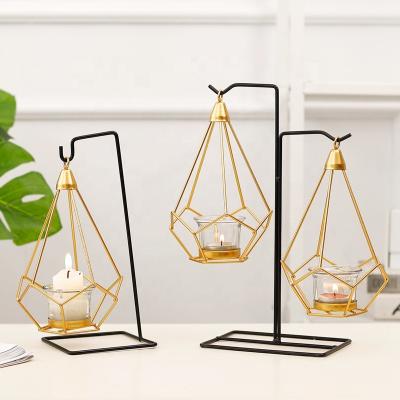 China Luxury and Modern Nordic Art Iron Statistical Gold Hanging Candlesticks for Home Decoration Metal Candle Holder Crafts Ornaments for sale