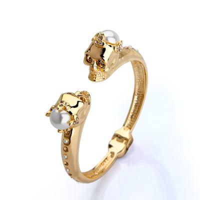 China Cheapest gold lady rhinestone skull chucky cuff bracelets trendy women jewelry bangle for sale for sale