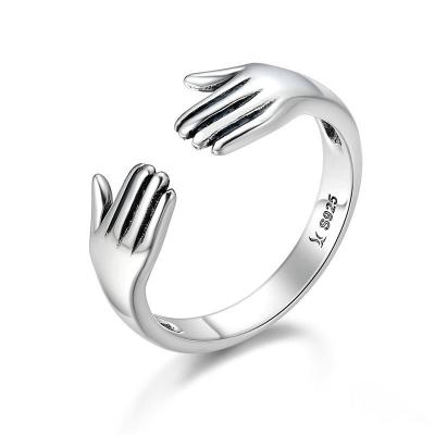 China Classic S925 Sterling Silver Hug Hands Shape Rings Open Adjustable Give Me A Hug 925 Sterling Silver Rings for sale