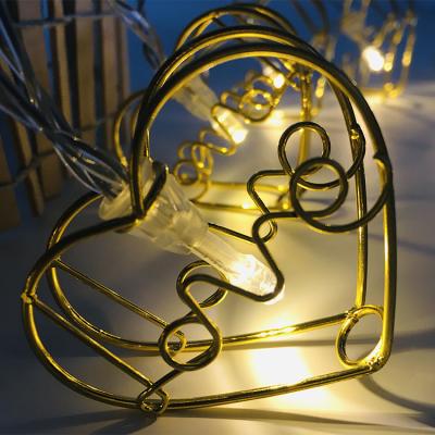 China Perfect Holiday Metal Heart Light LOVE Shaped Romantic Golden Electric String Light Iron Garland For Parties Decoration for sale