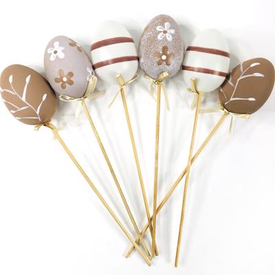 China Decorative Eggs Low Price Easter Egg Decor , Easter Decoration Brown Egg With Wooden Stick for sale