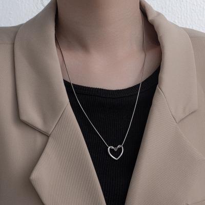 China Fashion Jewelry Vintage Stainless Steel Hollow Necklace Heart Pendant Minimalist Titanium Steel Necklace For Girls for sale