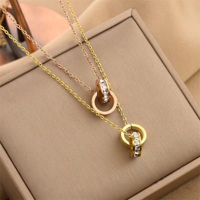 China FASHIONABLE New Trend Locking Rings Necklace Gold Plated Stainless Steel Double Rings Necklace Women Pendant Girls for sale