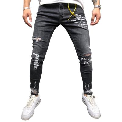 China Anti-pilling new style black color street style denim pants slim to stretch hole men ripped jeans for sale