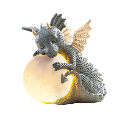 China Europe Garden Dragon Meditation Fairy Statue Solar Powered LED Lights Garden Decoration for sale