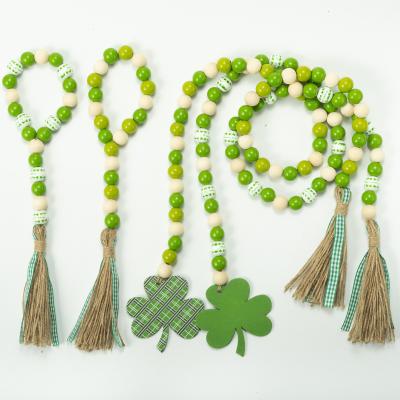 China Home Popular Wooden Clover Four-leaved Tassels String Bead Household Euramerican Decoration Irish Festival Decoration for sale