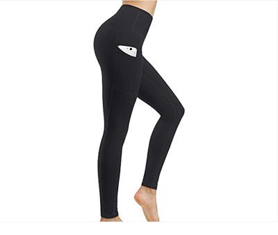 China New Breathable Yoga Fitness Polyester Spandex Leggings Women Floral High Waisted Seamless Yoga Pants With Phone Pocket for sale