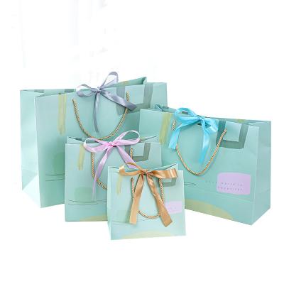 China Recyclable Wholesale Custom Printing Birthday Paper Present Recycled Gift Bags With Silk Ribbon Handles for sale