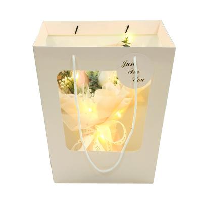 China Luxury Recyclable Custom Printing Commercial Stand Up Window Paper Gift Bags White Cardboard Flower Bag For Sale for sale