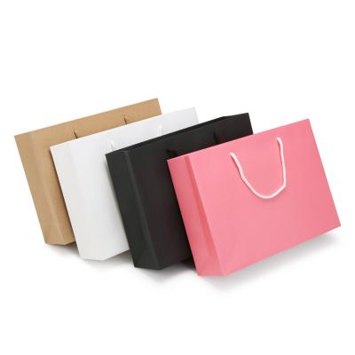 China Recyclable Wholesale Luxury Shoes Clothes Packing Eco Friendly Reusable Shopping Krft Paper Bags For Apparel Packaging for sale